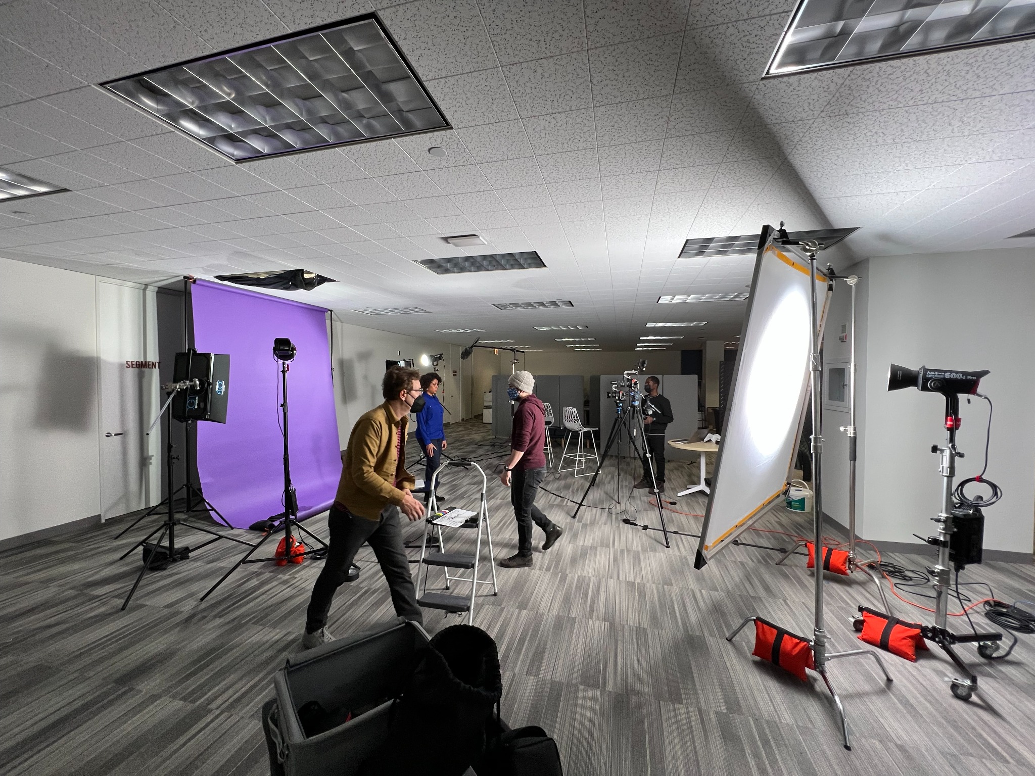 Wide lighting setup with diffusion frame and purple backdrop