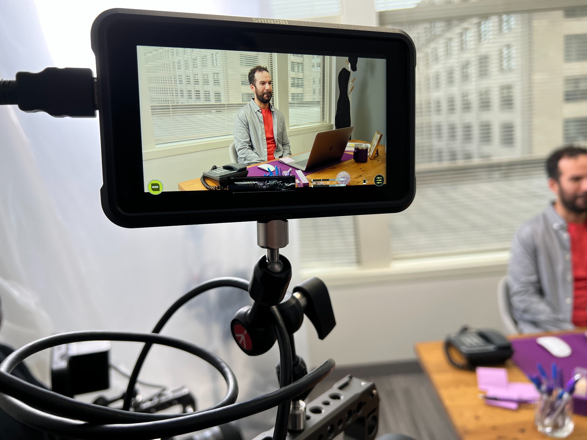 Close-up of a production monitor showing the final framed shot