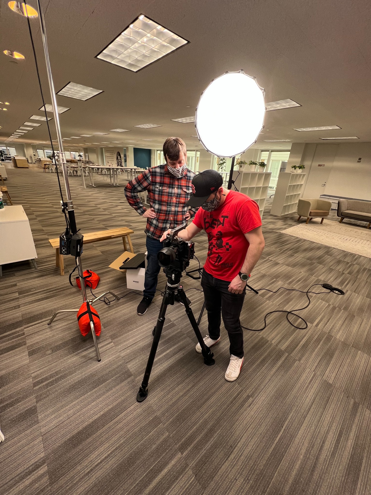 Crew checking camera and lighting setup
