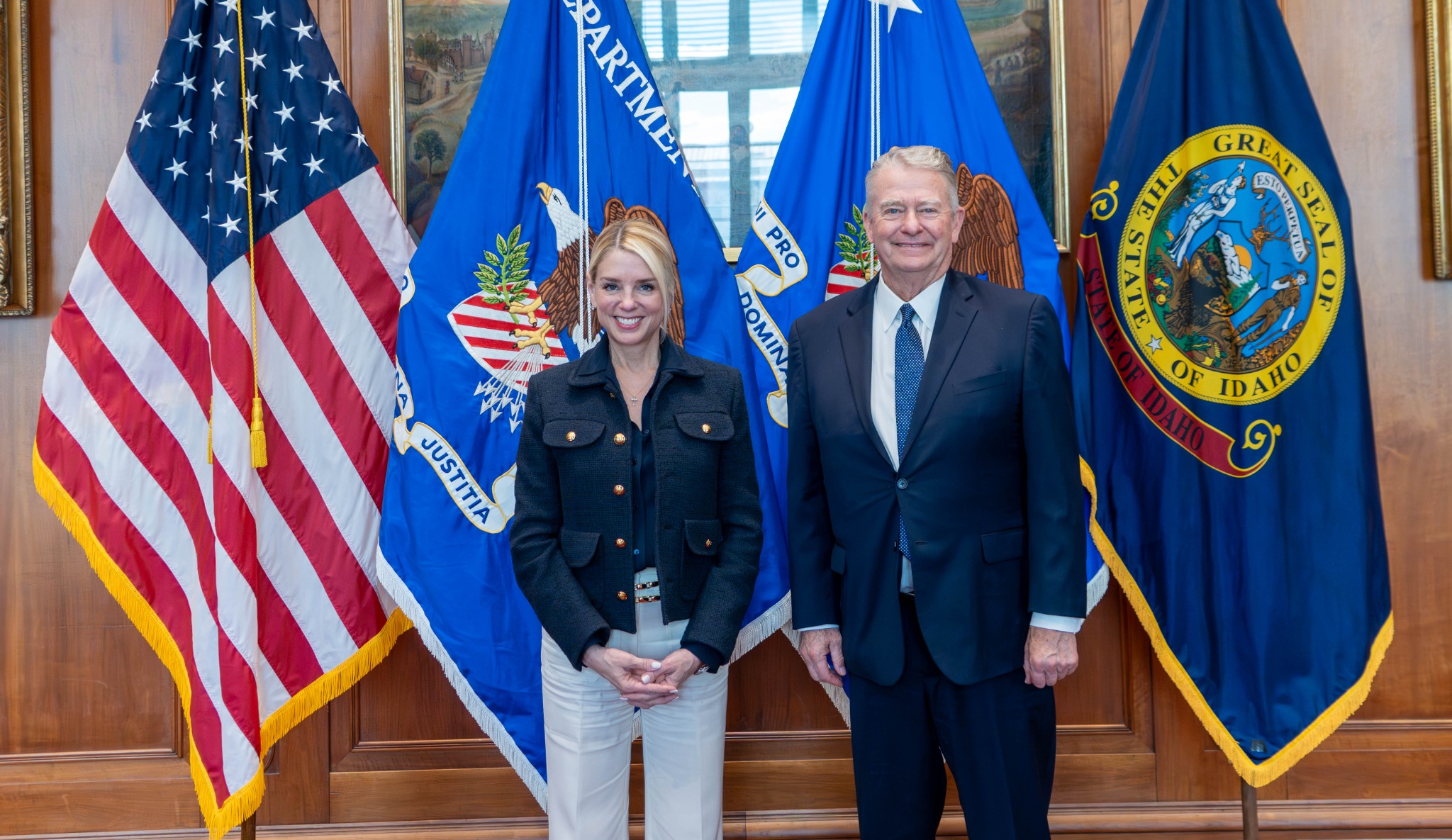 Official portrait with federal agency flags